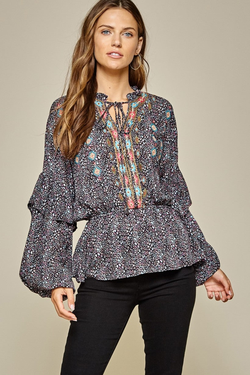 Multi color leopard pattern blouse with balloon sleeves.